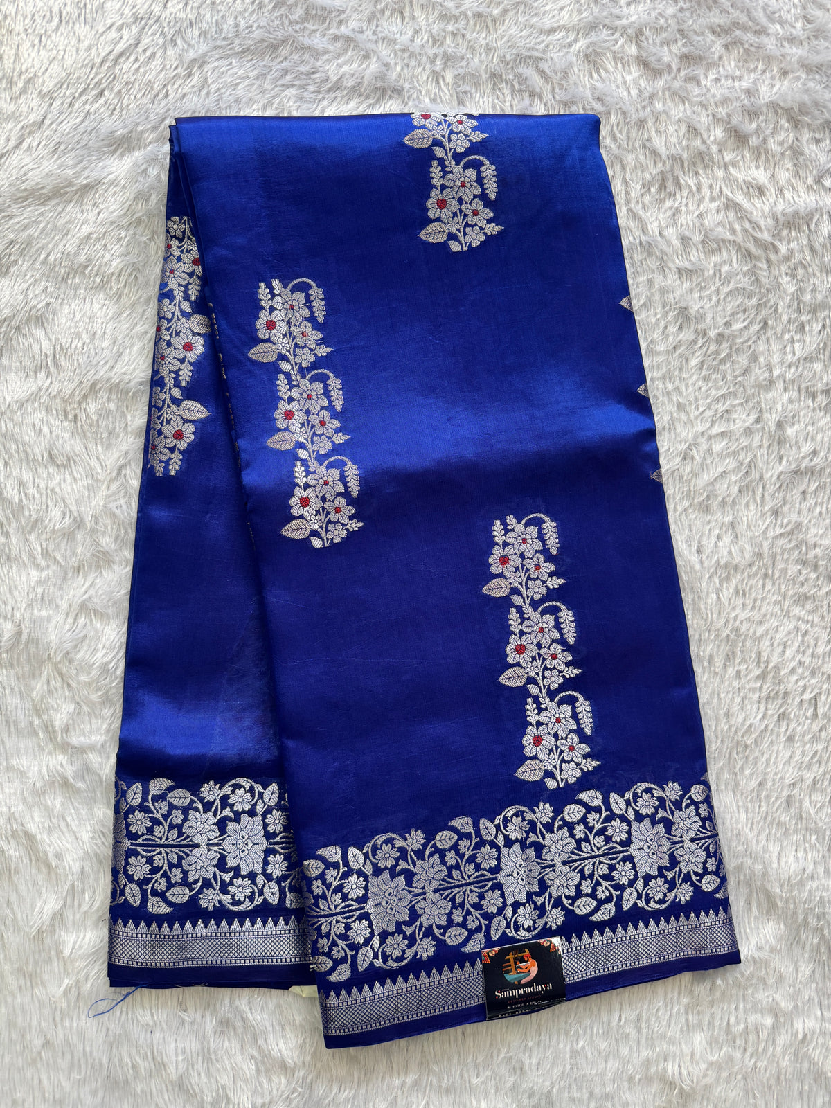 Pure Chiniya Silk Saree Blue Colored Elegantly Paired with a Gold Zari Border.