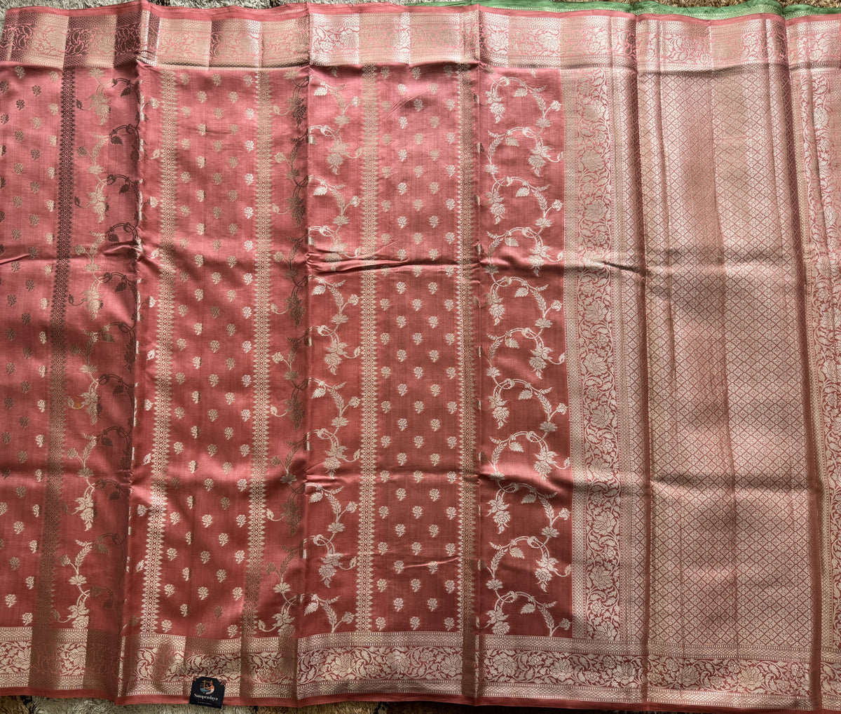 Pure Chiniya Silk Saree Peach Colored Elegantly Paired with a Gold Zari Border.