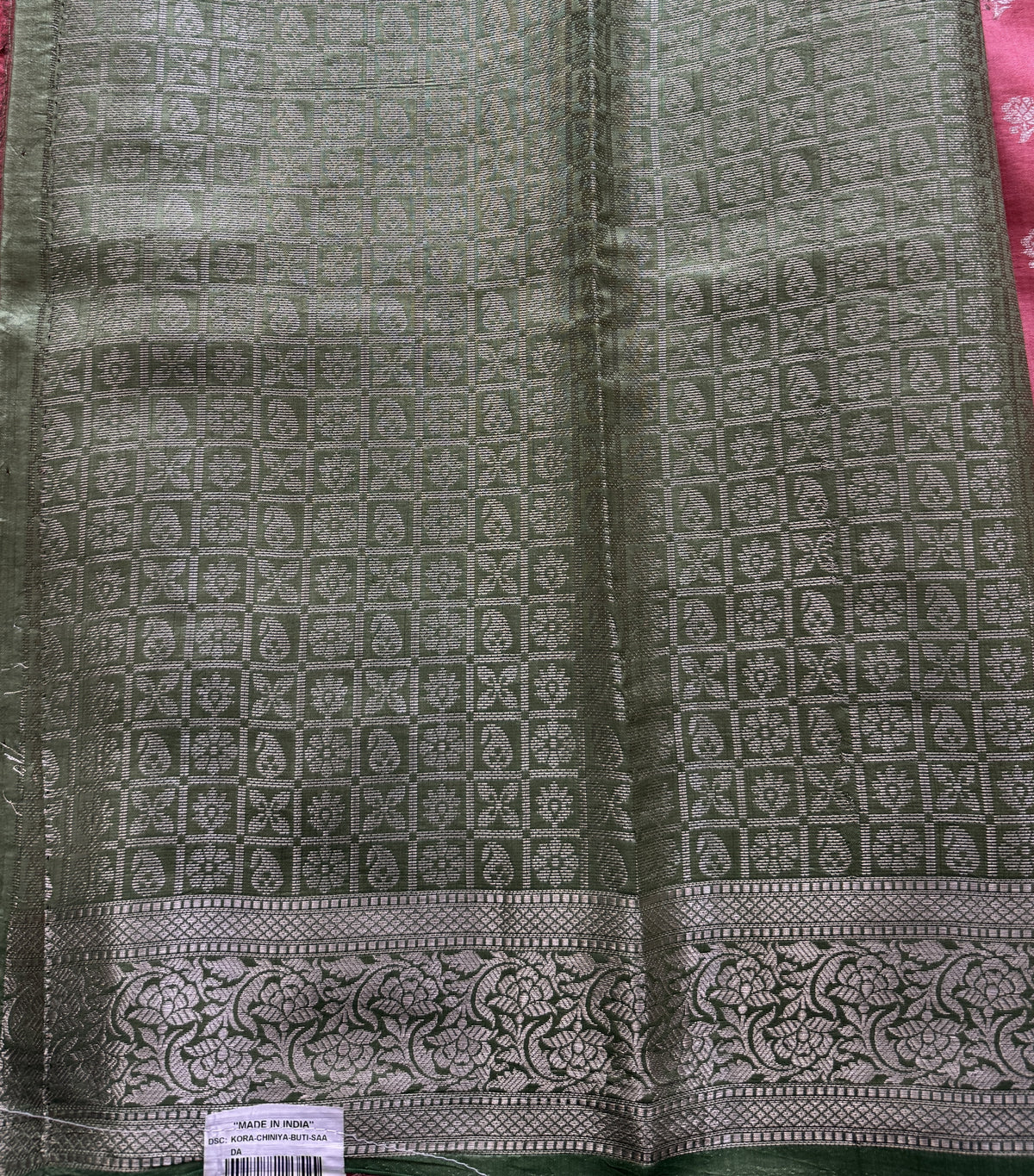 Pure Chiniya Silk Saree Peach Colored Elegantly Paired with a Gold Zari Border.