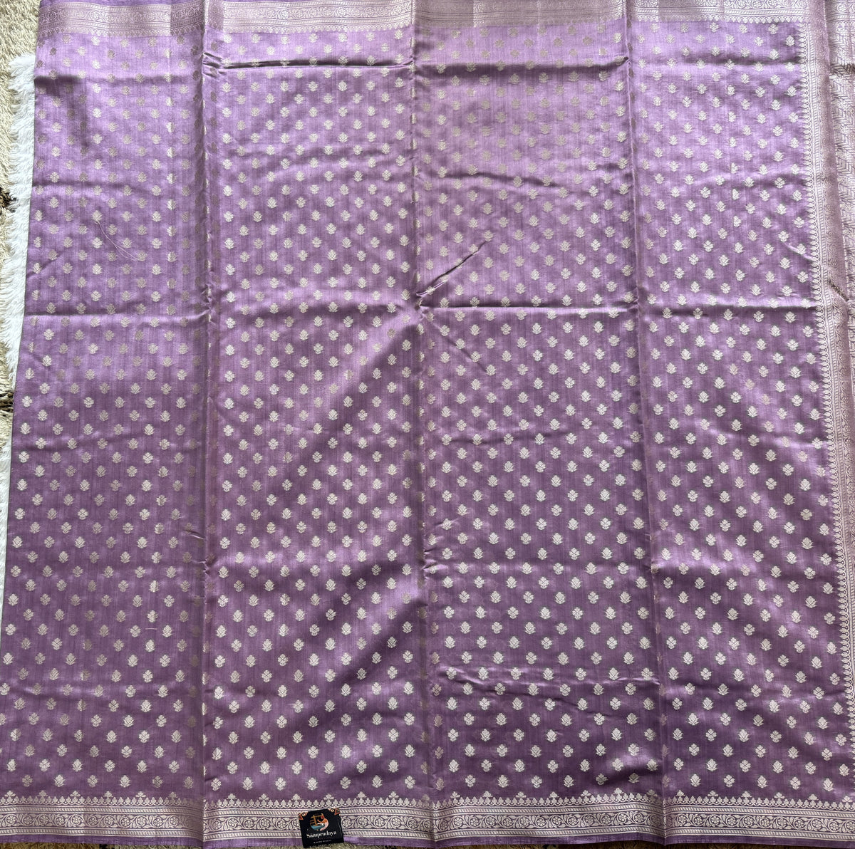 Pure Chiniya Silk Saree Lavender Colored Elegantly Paired with a Gold Zari Border.