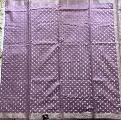 Pure Chiniya Silk Saree Lavender Colored Elegantly Paired with a Gold Zari Border.