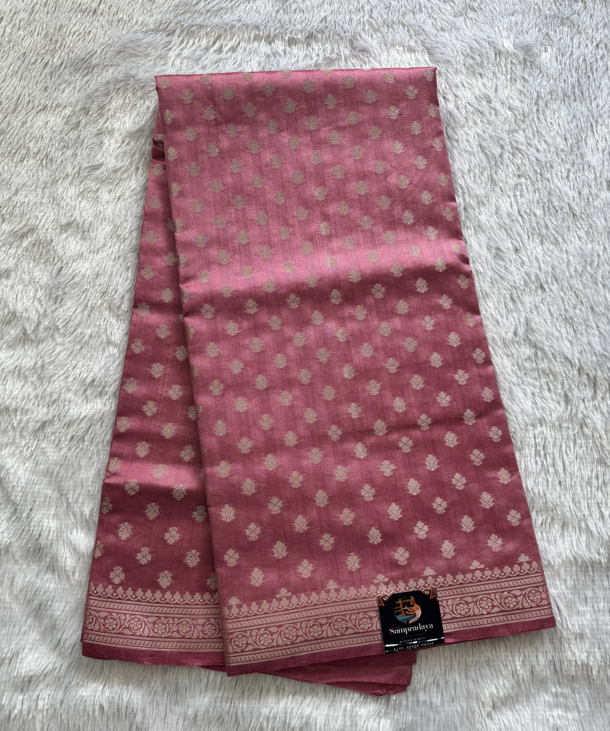 Pure Chiniya Silk Saree Baby Pink Colored Elegantly Paired with a Gold Zari Border.