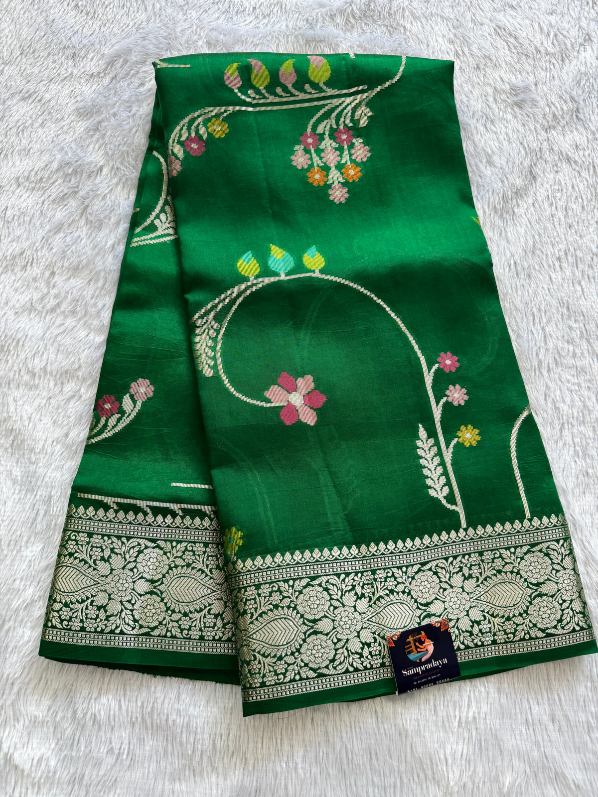 Pure Chiniya Silk Saree Parrot Green Colored Elegantly Paired with a Gold Zari Border.