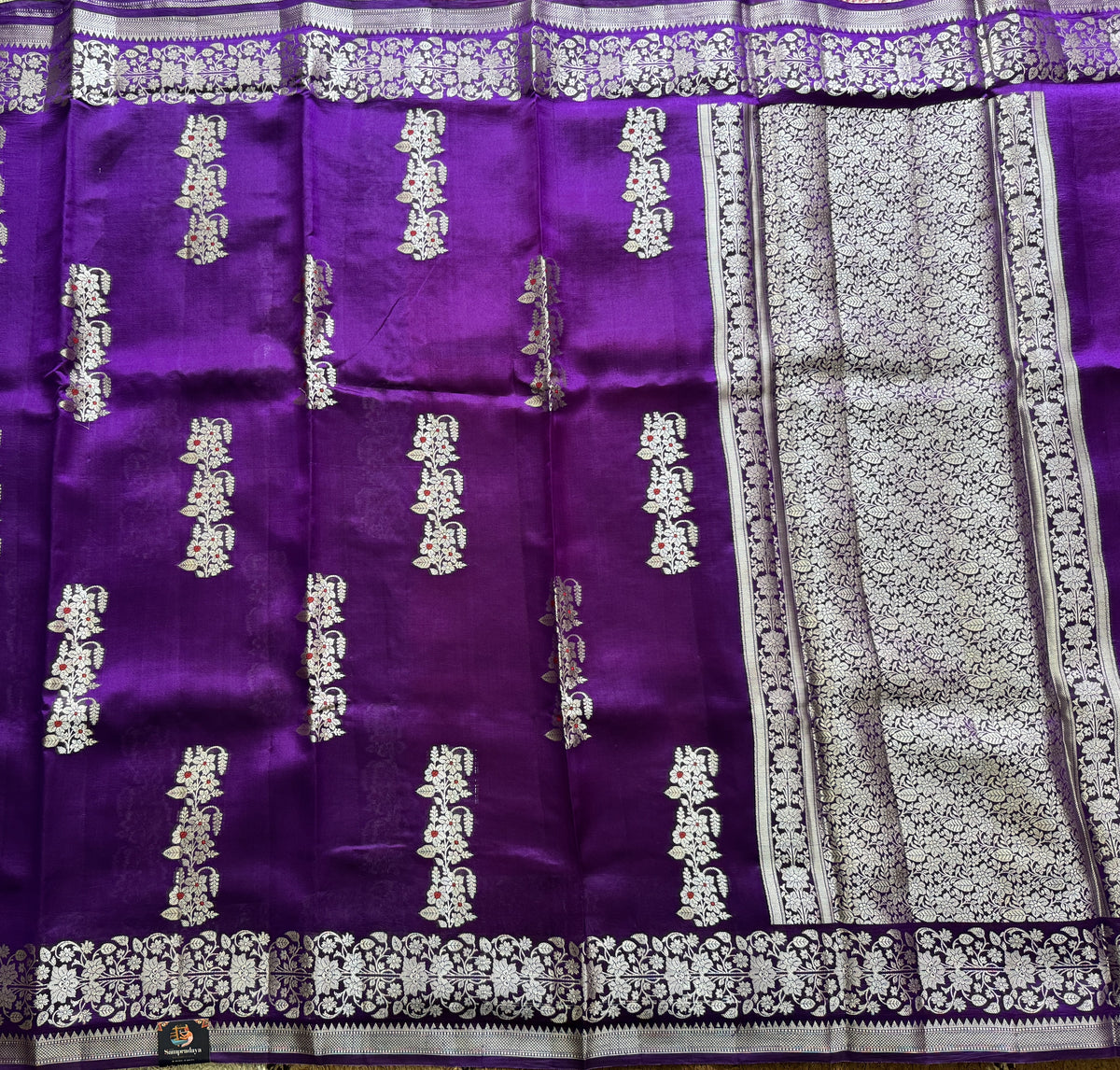Pure Chiniya Silk Saree Purple Colored Elegantly Paired with a Gold Zari Border.