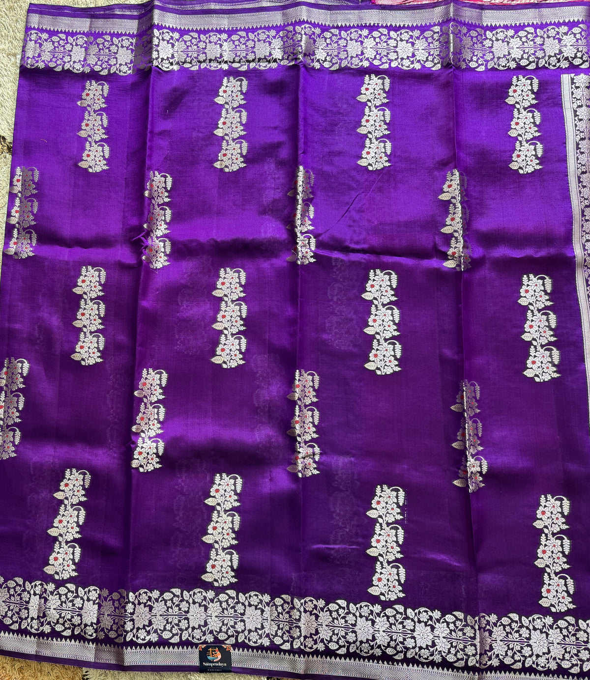 Pure Chiniya Silk Saree Purple Colored Elegantly Paired with a Gold Zari Border.