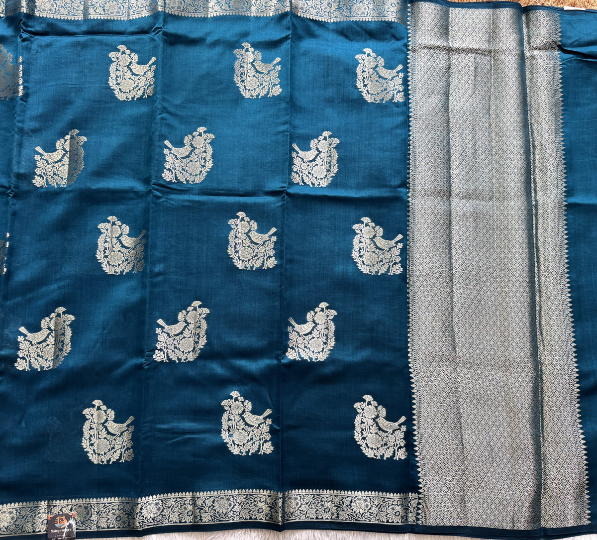Pure Chiniya Silk Saree Peacock Blue Colored Elegantly Paired with a Gold Zari Border.