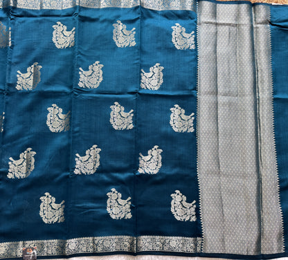 Pure Chiniya Silk Saree Peacock Blue Colored Elegantly Paired with a Gold Zari Border.