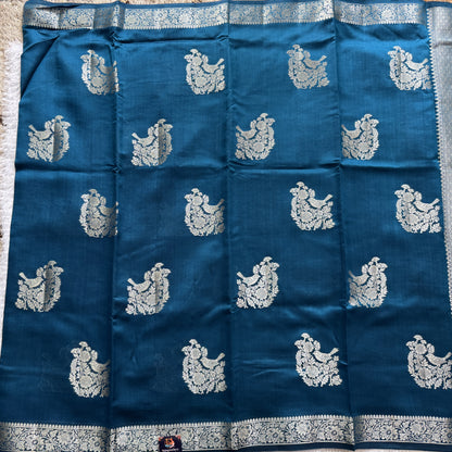 Pure Chiniya Silk Saree Peacock Blue Colored Elegantly Paired with a Gold Zari Border.