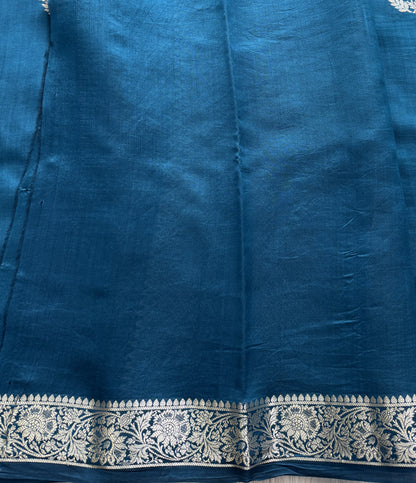 Pure Chiniya Silk Saree Peacock Blue Colored Elegantly Paired with a Gold Zari Border.
