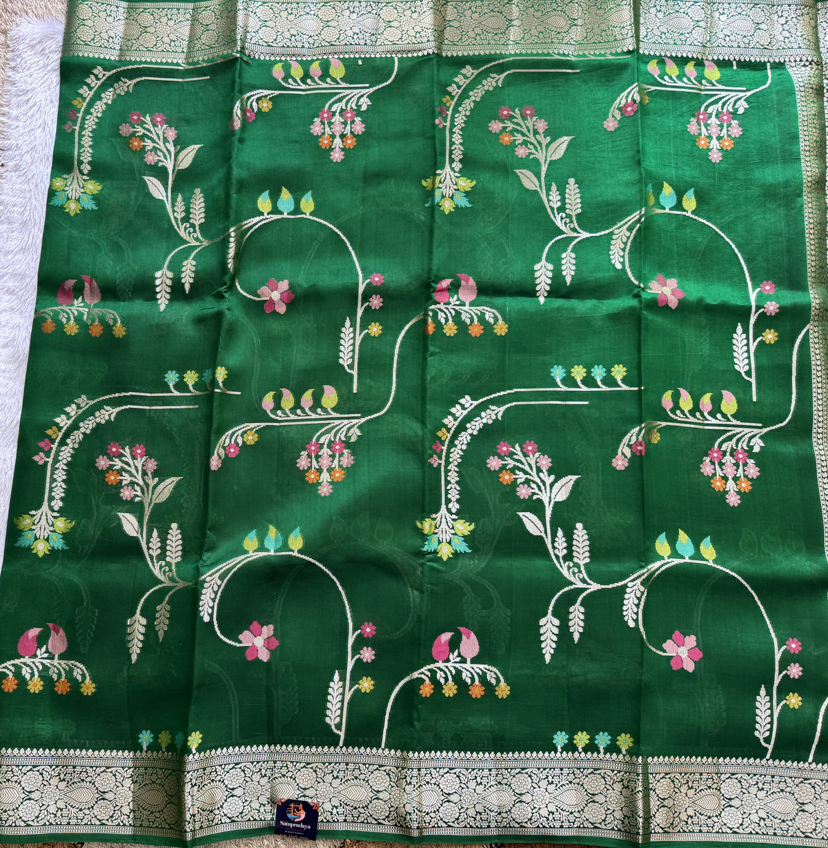 Pure Chiniya Silk Saree Parrot Green Colored Elegantly Paired with a Gold Zari Border.