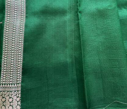 Pure Chiniya Silk Saree Parrot Green Colored Elegantly Paired with a Gold Zari Border.