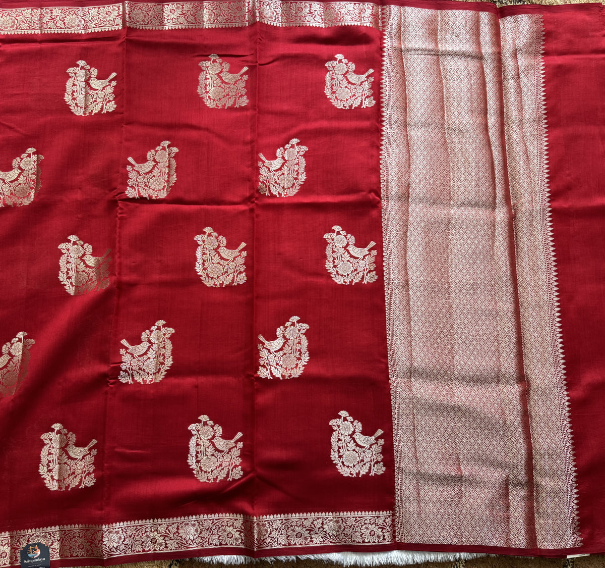 Pure Chiniya Silk Saree Red Colored Elegantly Paired with a Gold Zari Border.
