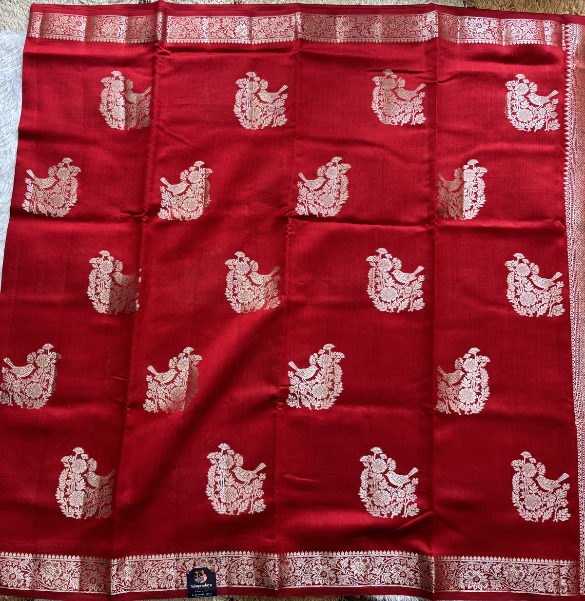 Pure Chiniya Silk Saree Red Colored Elegantly Paired with a Gold Zari Border.