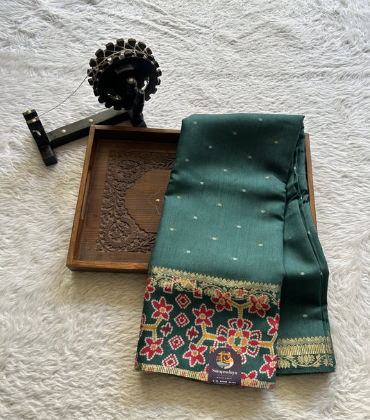Pure Moonga Tussar Silk Saree Peacock Green Color Complemented with a Patolla Border. - Sampradaya Designer Studio