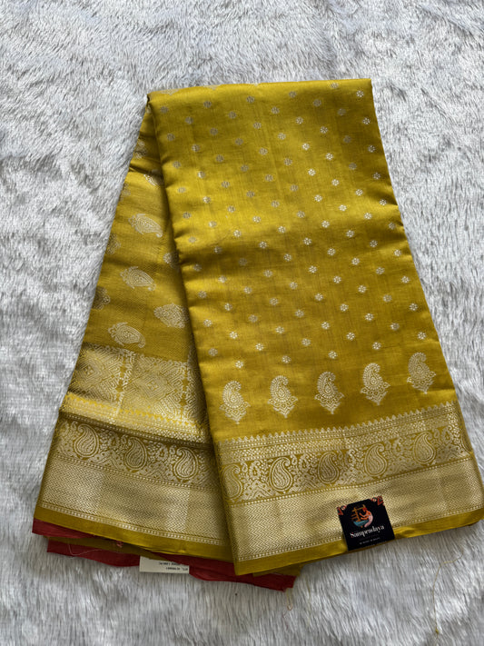 Pure Chiniya Silk Saree Yellow Colored Elegantly Paired with a Gold Zari Border.