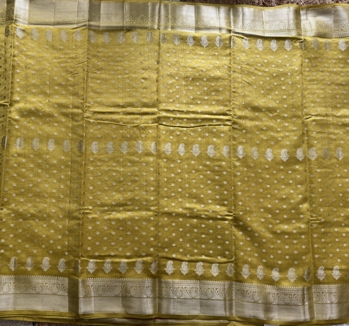 Pure Chiniya Silk Saree Yellow Colored Elegantly Paired with a Gold Zari Border.