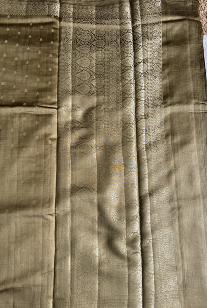 Pure Chiniya Silk Saree Gold Colored Elegantly Paired with a Gold Zari Border.