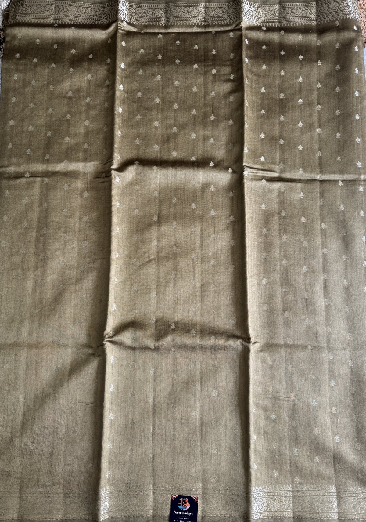 Pure Chiniya Silk Saree Gold Colored Elegantly Paired with a Gold Zari Border.