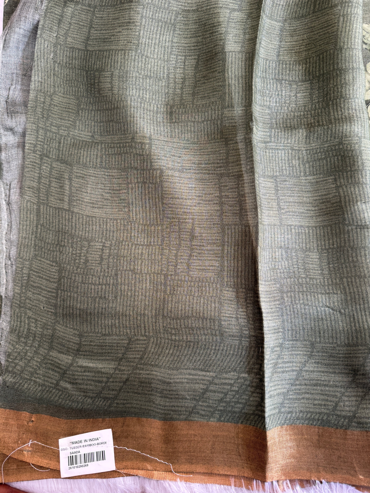 Pure Chiniya Silk Saree Olive Colored Elegantly Paired with a Gold Zari Border.