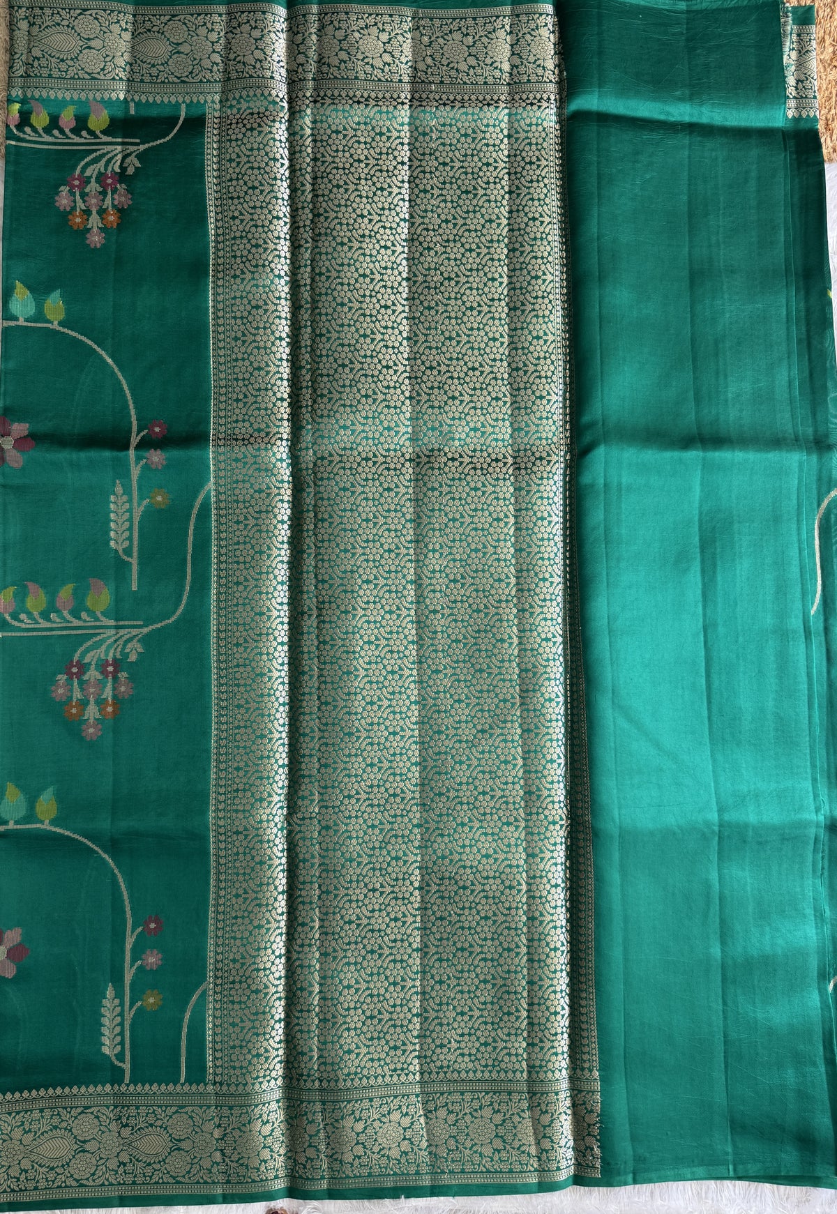 Pure Chiniya Silk Saree Rama Green Colored Elegantly Paired with a Gold Zari Border.