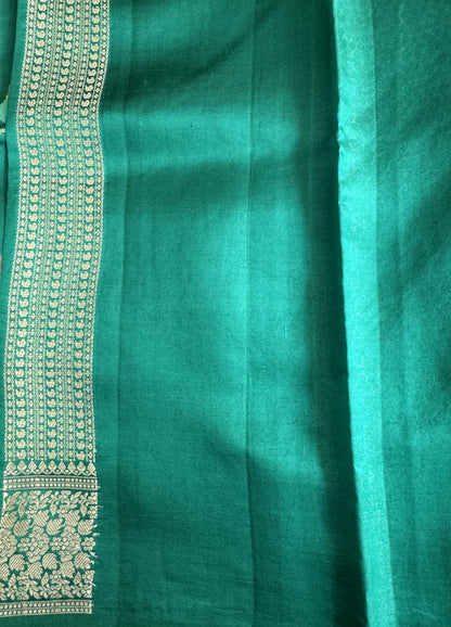 Pure Chiniya Silk Saree Rama Green Colored Elegantly Paired with a Gold Zari Border.