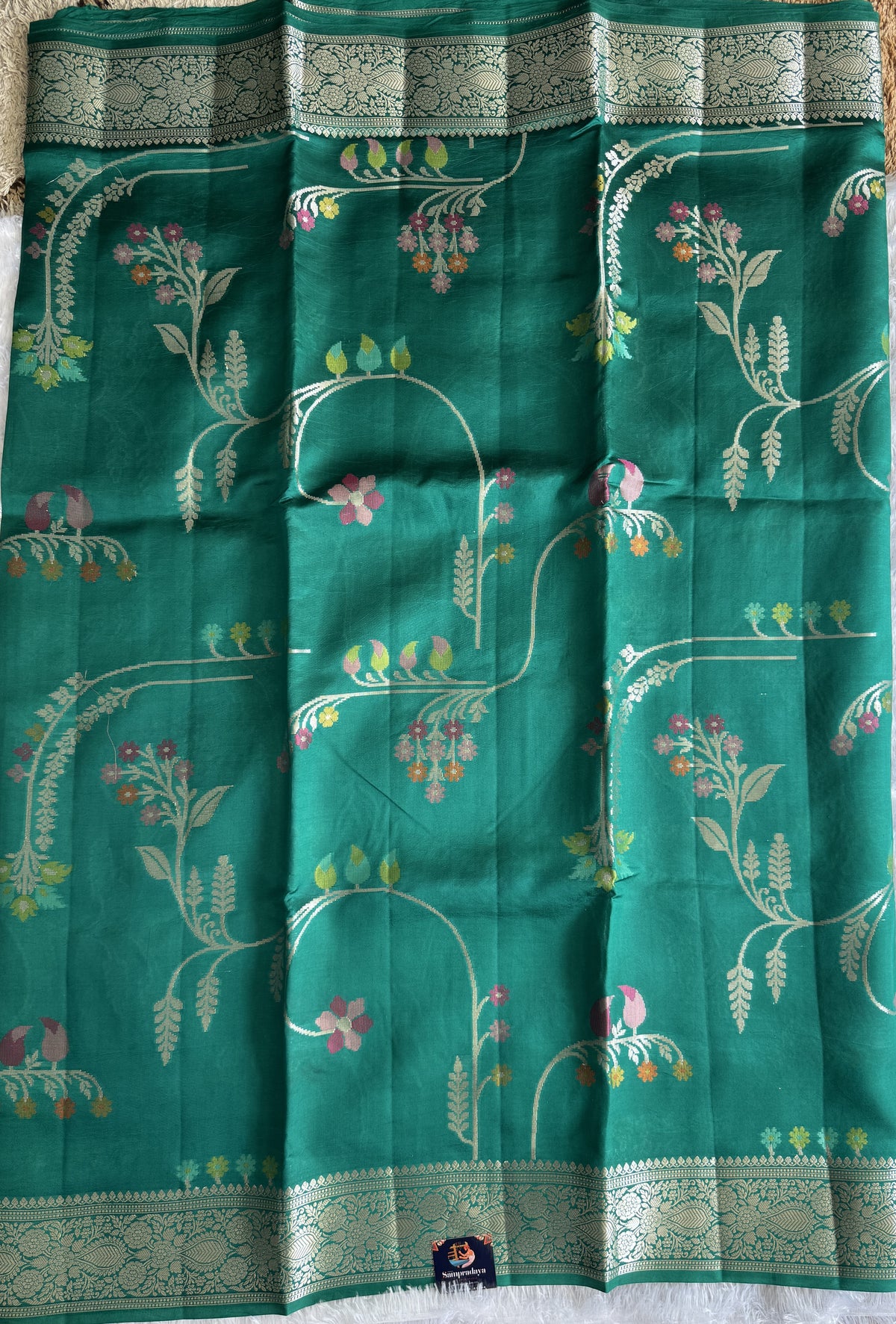 Pure Chiniya Silk Saree Rama Green Colored Elegantly Paired with a Gold Zari Border.