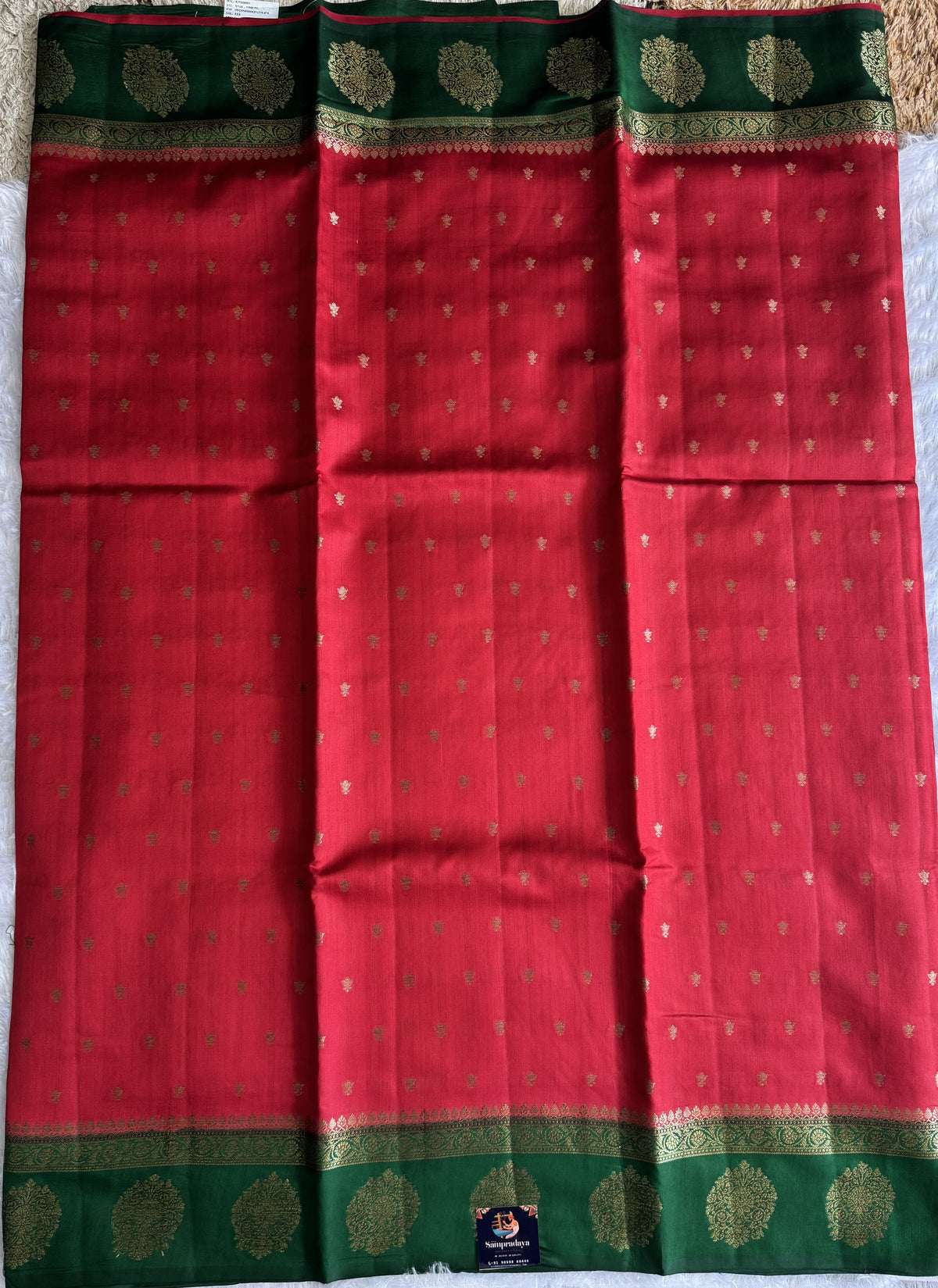 Pure Chiniya Silk Saree Red Colored Elegantly Paired with a Gold Zari Border.