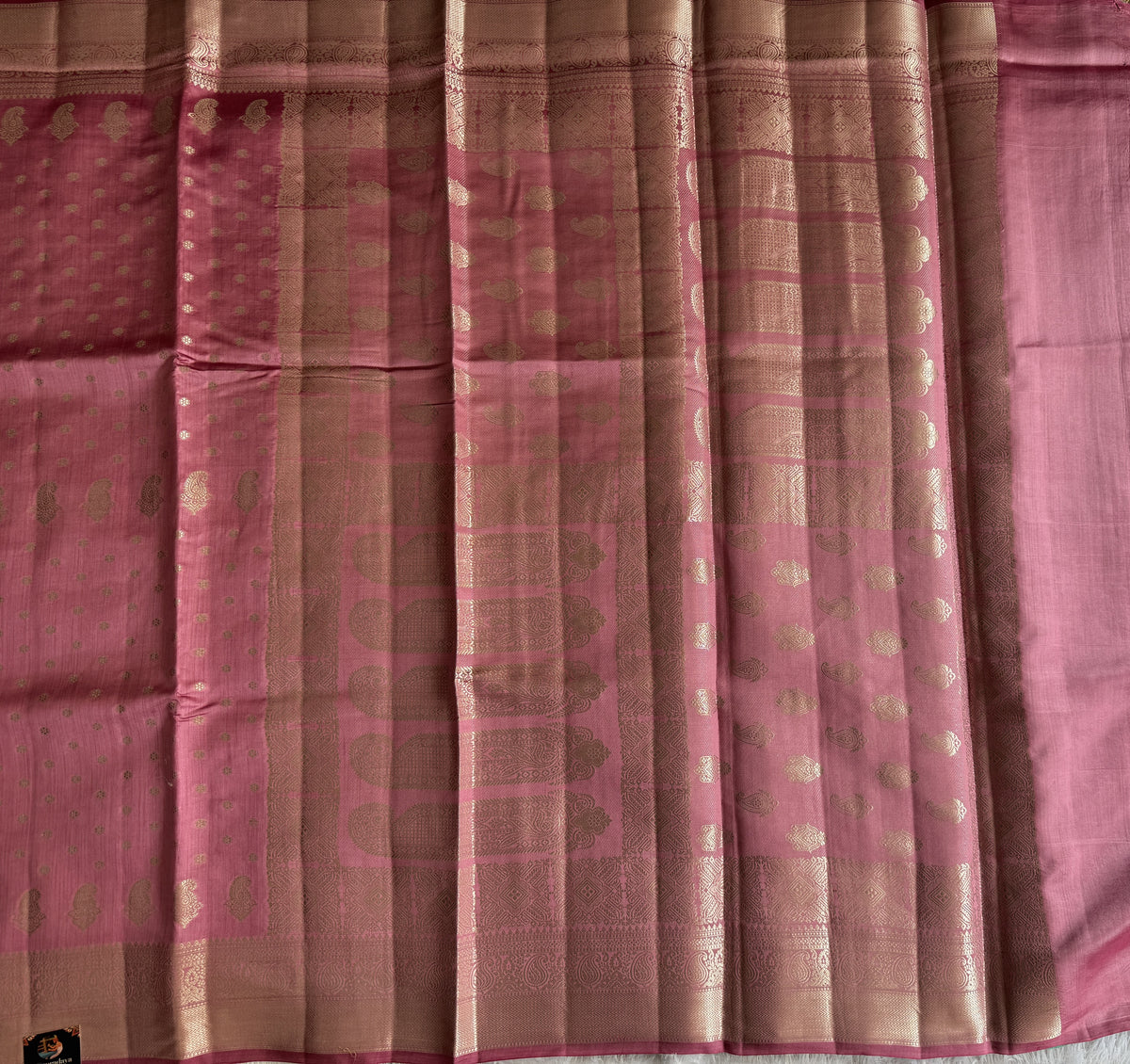 Pure Chiniya Silk Saree Baby Pink Colored Elegantly Paired with a Gold Zari Border.