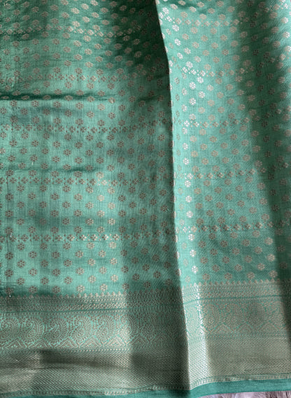 Pure Chiniya Silk Saree Baby Pink Colored Elegantly Paired with a Gold Zari Border.