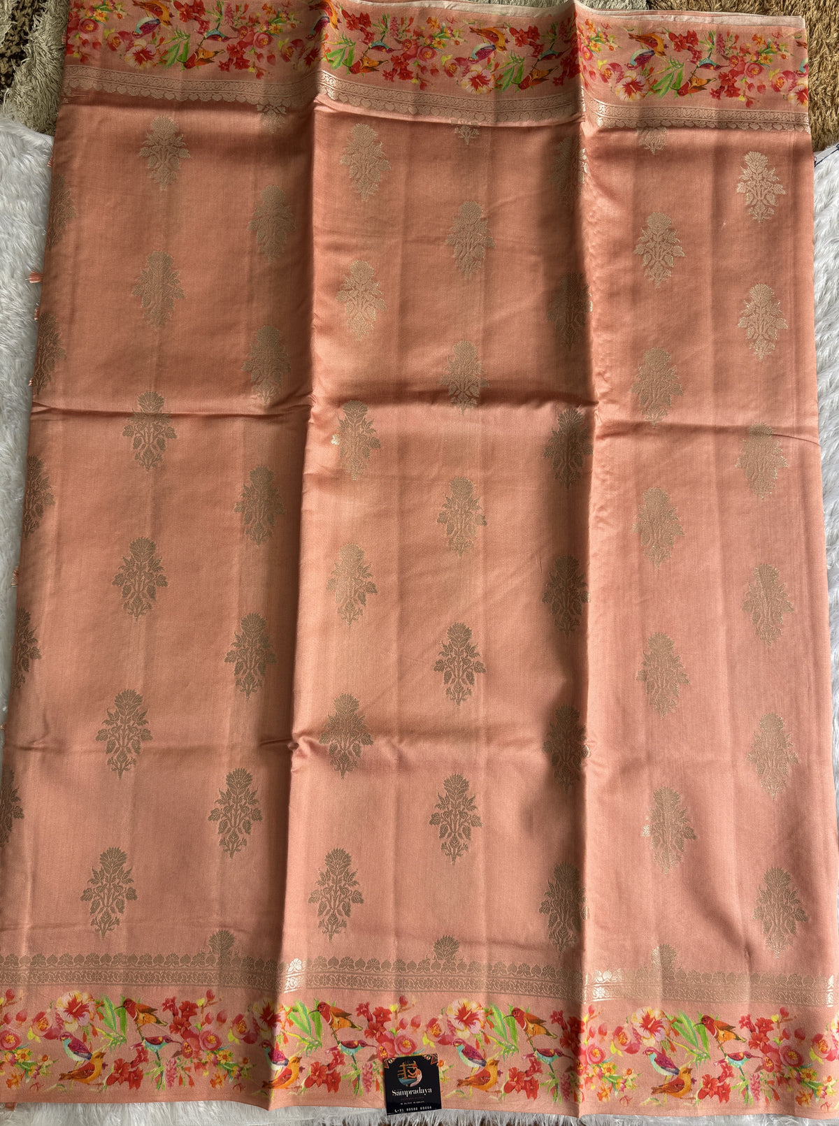 Pure Chiniya Silk Saree Peach Colored Elegantly Paired with a Gold Zari Border.