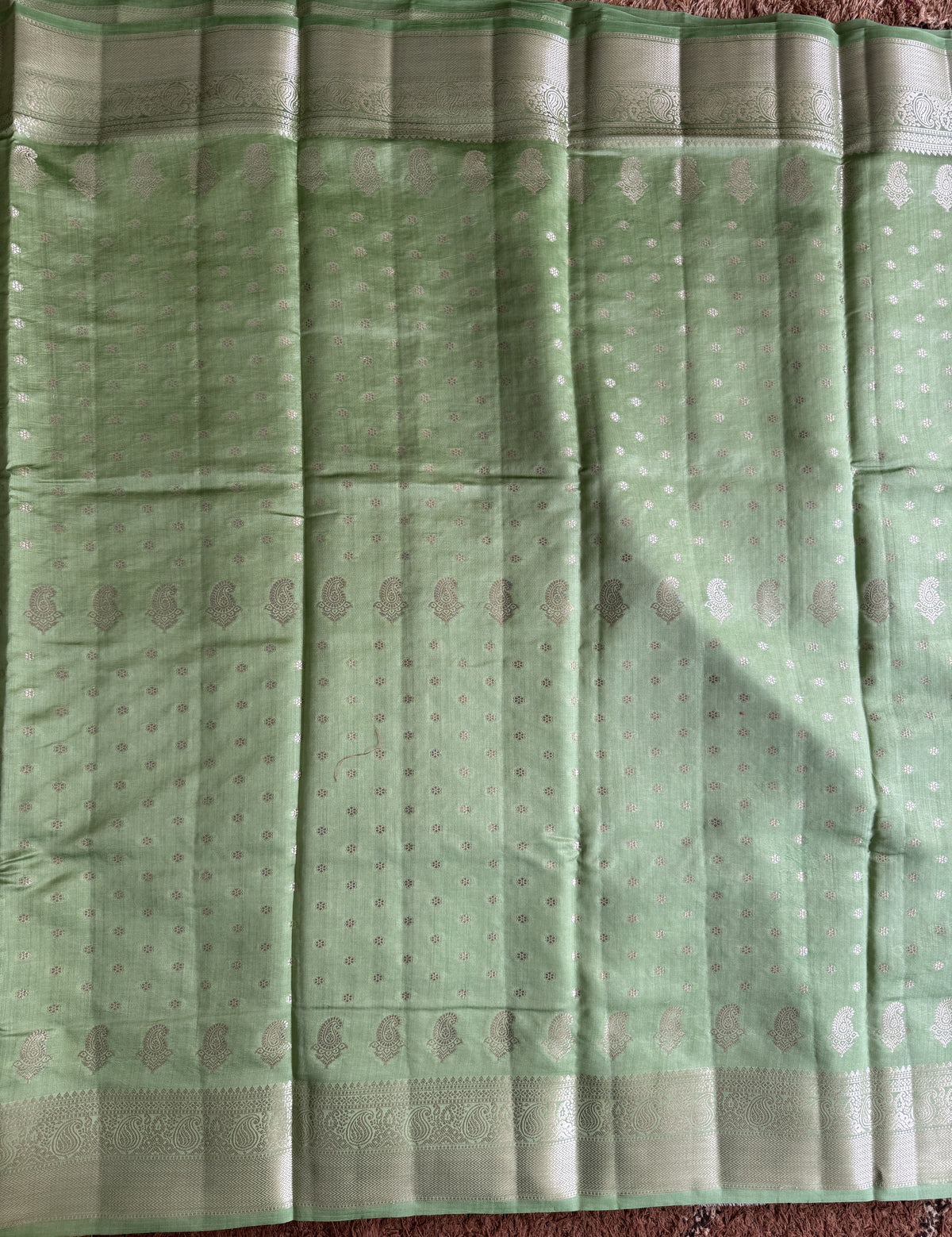 Pure Chiniya Silk Saree Sea Green Colored Elegantly Paired with a Gold Zari Border.