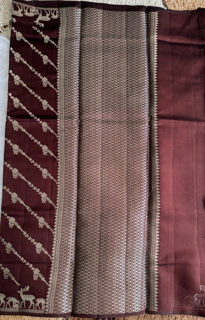Pure Chiniya Silk Saree Brown Colored Elegantly Paired with a Gold Zari Border.