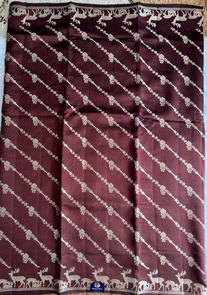 Pure Chiniya Silk Saree Brown Colored Elegantly Paired with a Gold Zari Border.