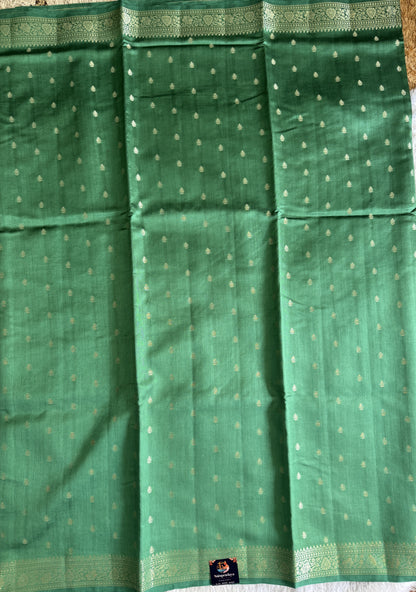 Pure Chiniya Silk Saree Sea Green Colored Elegantly Paired with a Gold Zari Border.