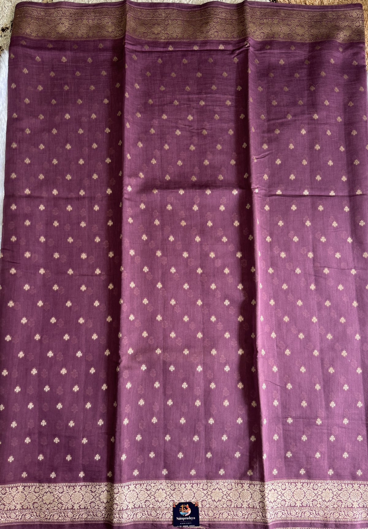 Pure Chiniya Silk Saree warm Plum Colored Elegantly Paired with a Gold Zari Border.
