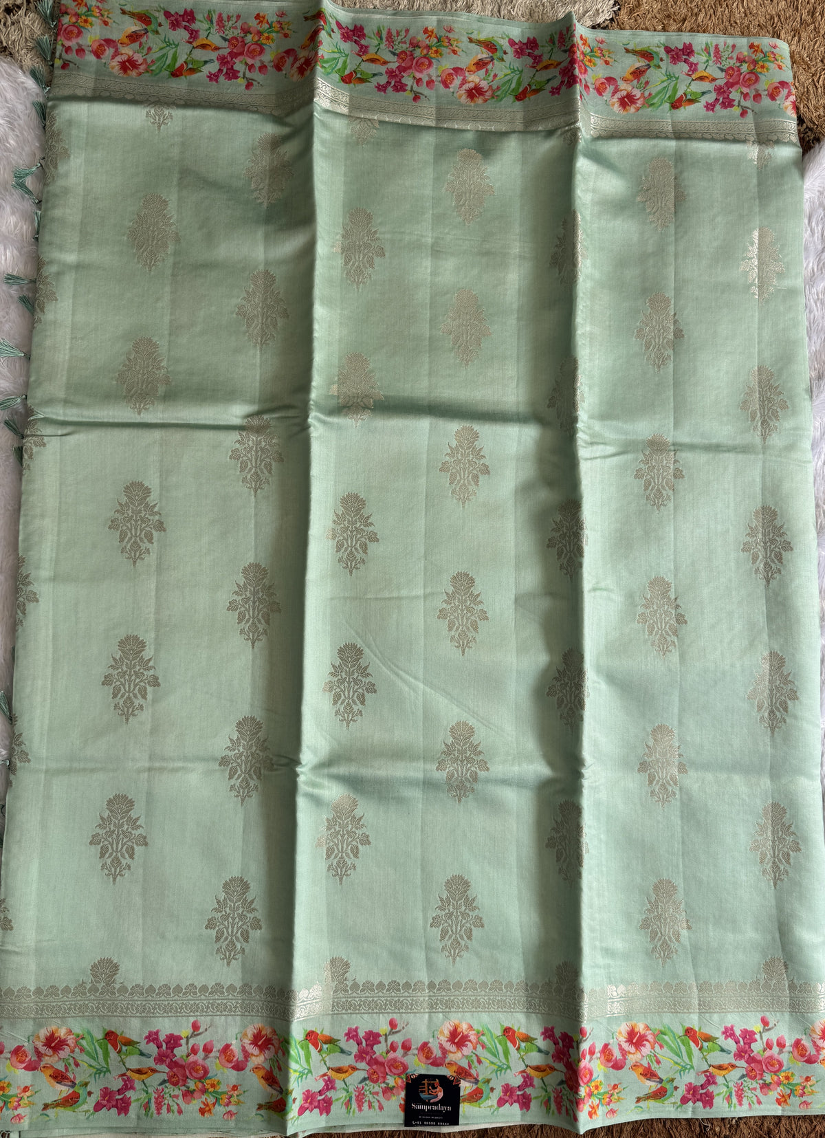 Pure Chiniya Silk Saree Ice Blue Colored Elegantly Paired with a Gold Zari Border.