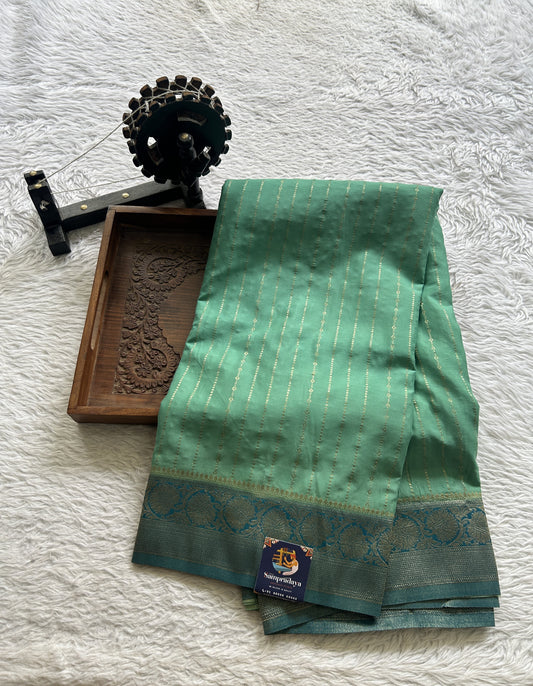 Semi Georgette Saree Aqua Green Colored Elegantly Paired with a Zari Border. - Sampradaya Designer Studio