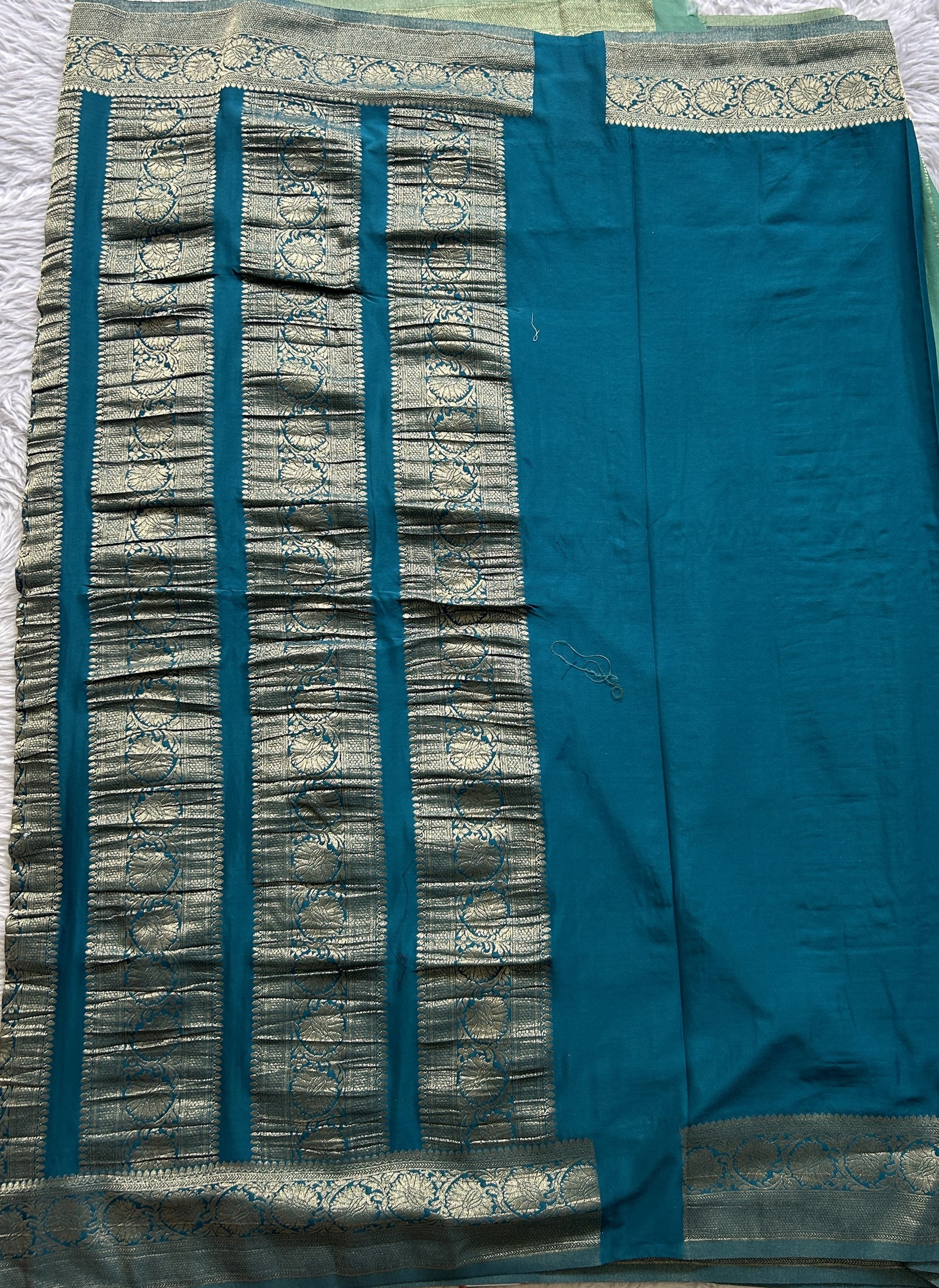 Semi Georgette Saree Aqua Green Colored Elegantly Paired with a Zari Border. - Sampradaya Designer Studio