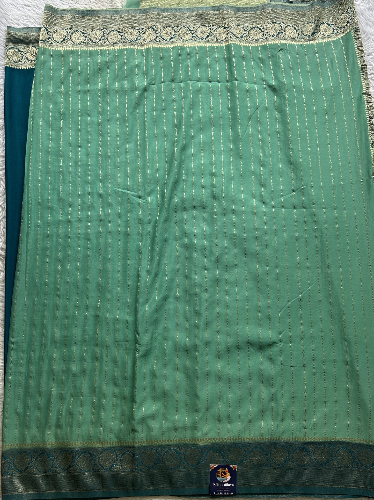 Semi Georgette Saree Aqua Green Colored Elegantly Paired with a Zari Border. - Sampradaya Designer Studio