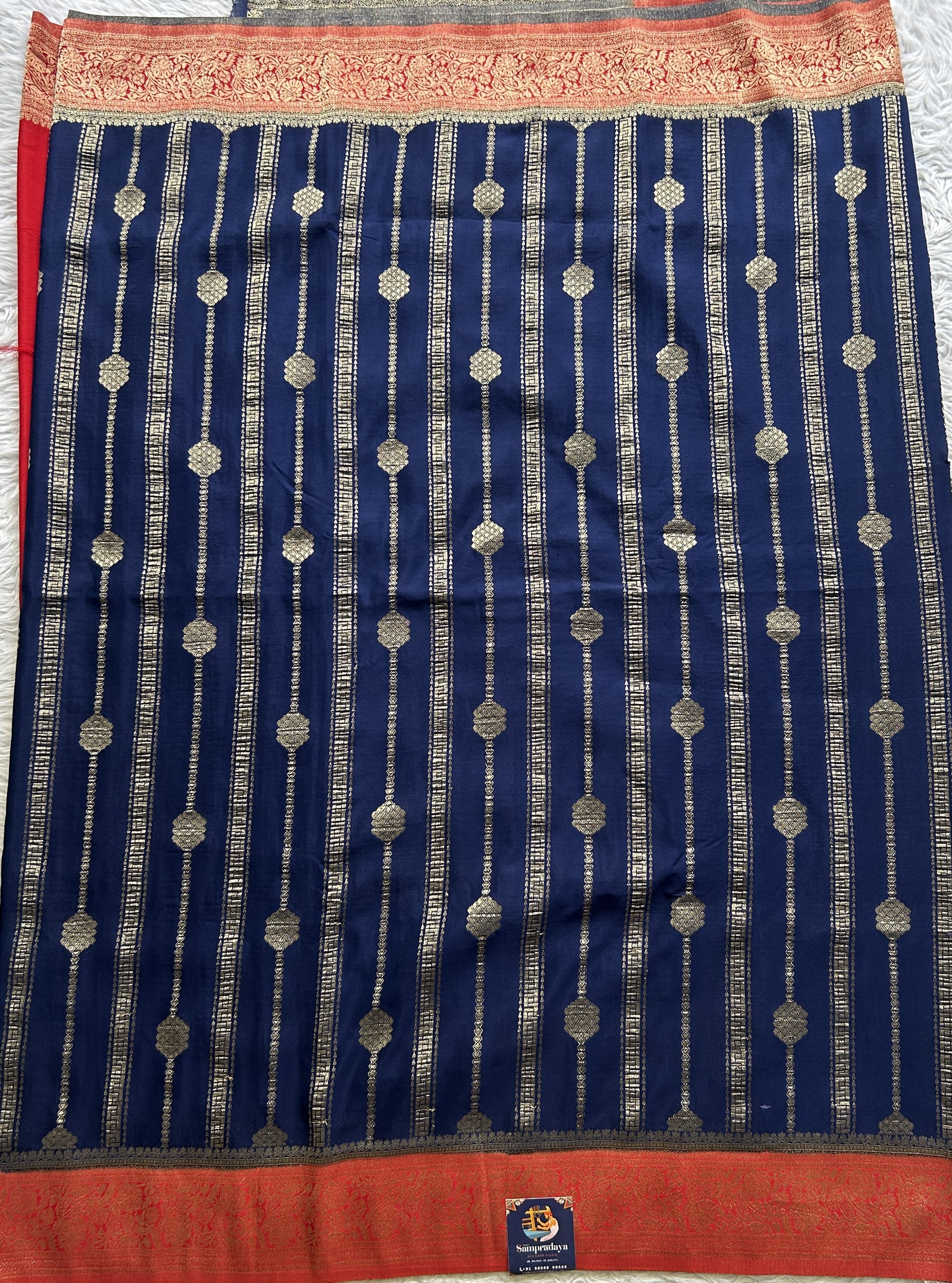 Semi Georgette Saree Ink Blue Colored Elegantly Paired with a Zari Border. - Sampradaya Designer Studio