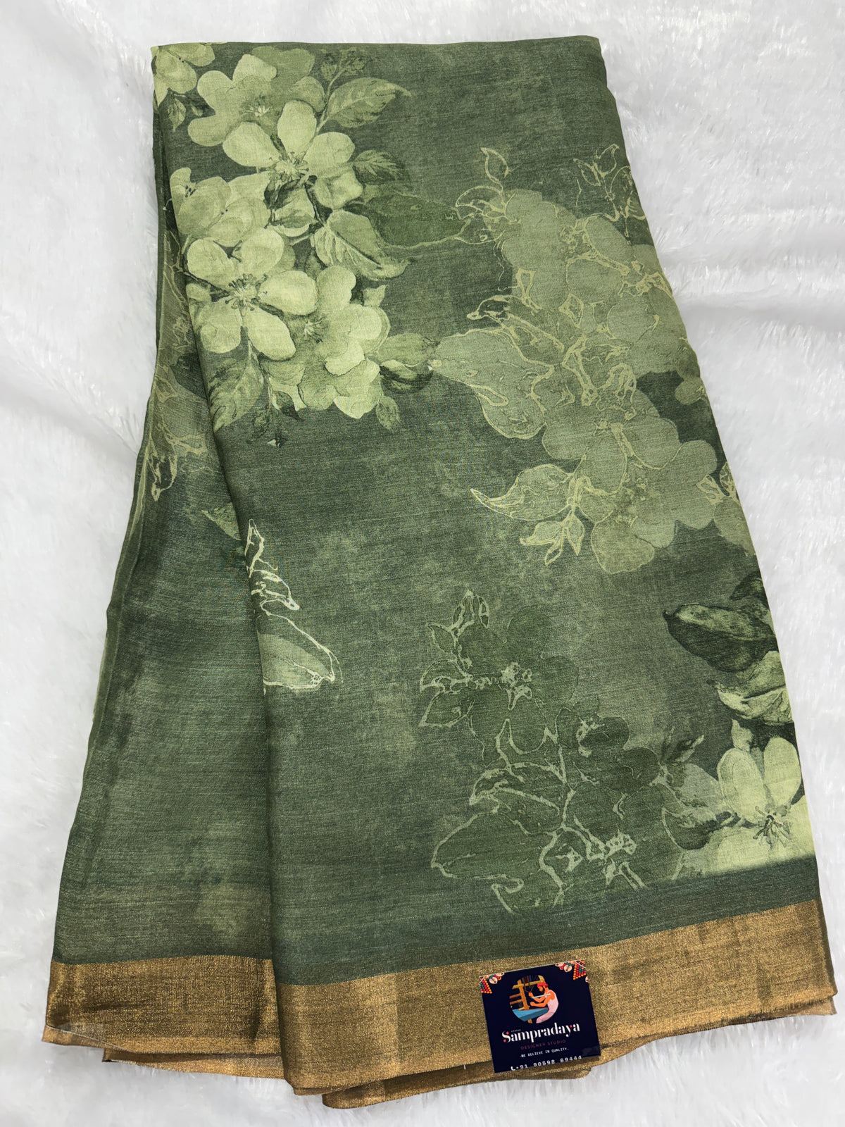Pure Chiniya Silk Saree Olive Colored Elegantly Paired with a Gold Zari Border.
