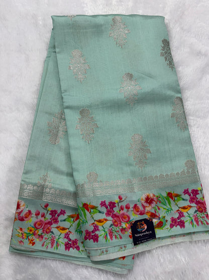 Pure Chiniya Silk Saree Ice Blue Colored Elegantly Paired with a Gold Zari Border.