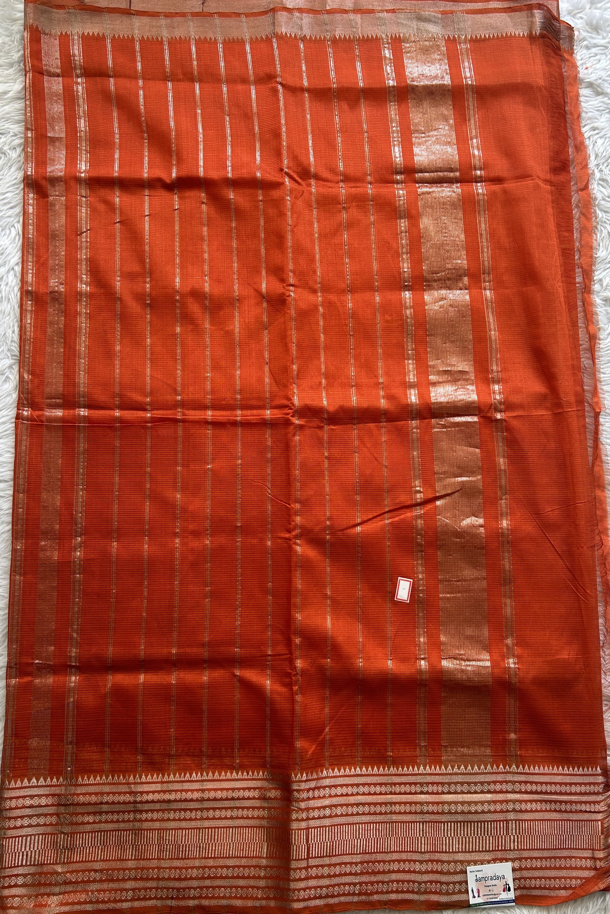 Mangalagiri Plain Pattu Saree Orange colored complemented with a Zari Border - Sampradaya Designer Studio