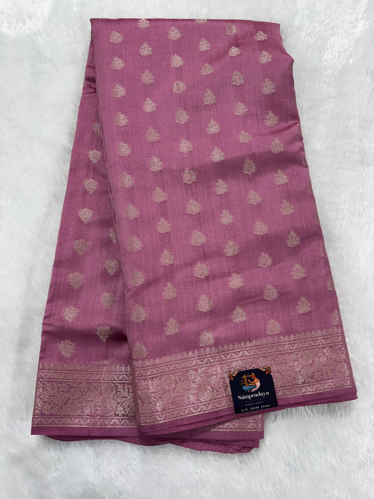 Pure Chiniya Silk Saree Baby Pink Colored Elegantly Paired with a Gold Zari Border.
