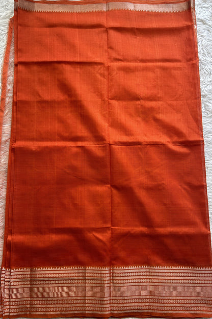 Mangalagiri Plain Pattu Saree Orange colored complemented with a Zari Border - Sampradaya Designer Studio