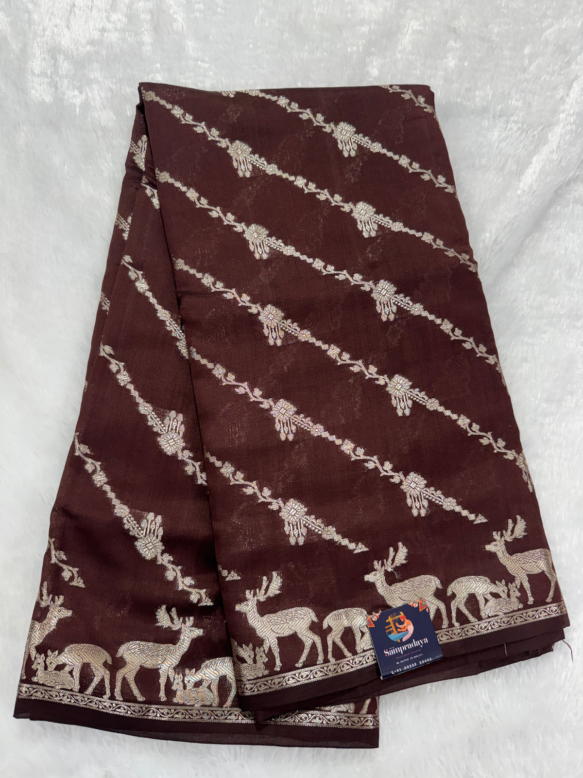 Pure Chiniya Silk Saree Brown Colored Elegantly Paired with a Gold Zari Border.