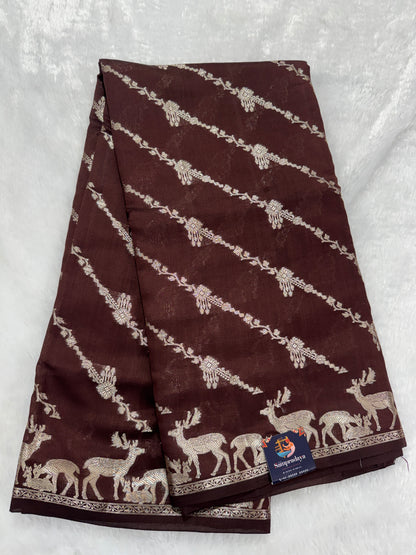 Pure Chiniya Silk Saree Brown Colored Elegantly Paired with a Gold Zari Border.