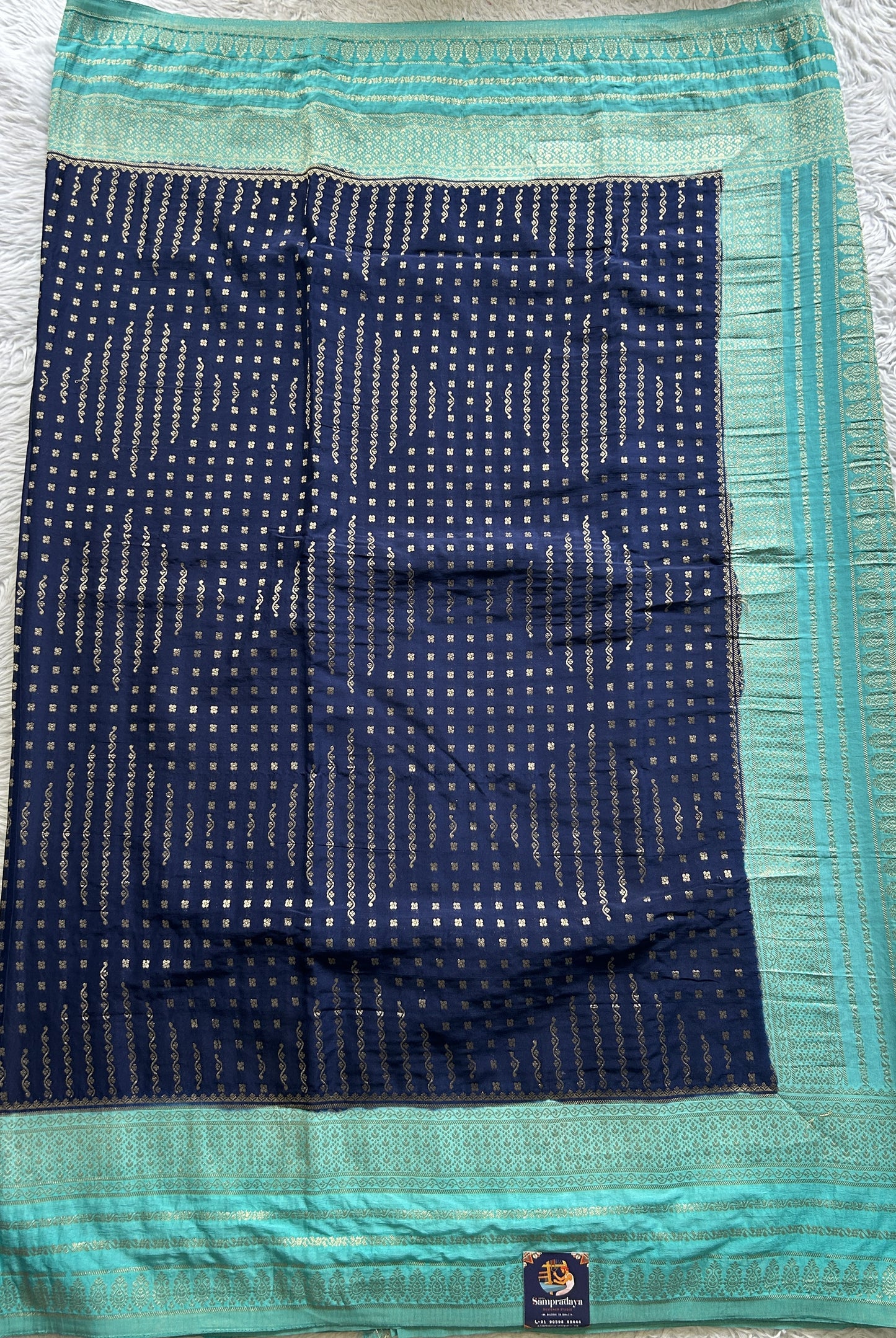 Semi Georgette Saree Navy Blue Colored Elegantly Paired with a Zari Border. - Sampradaya Designer Studio
