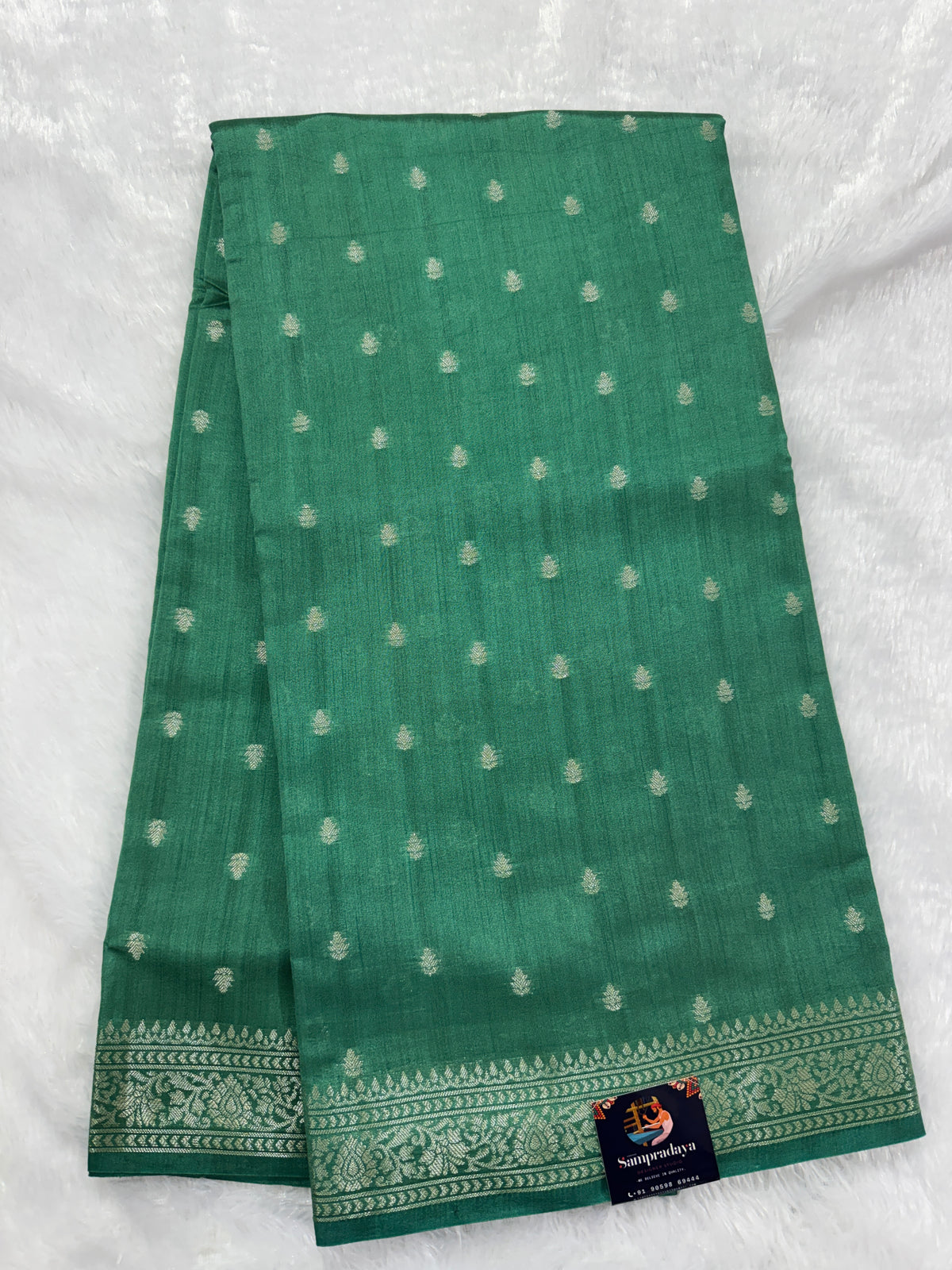 Pure Chiniya Silk Saree Sea Green Colored Elegantly Paired with a Gold Zari Border.