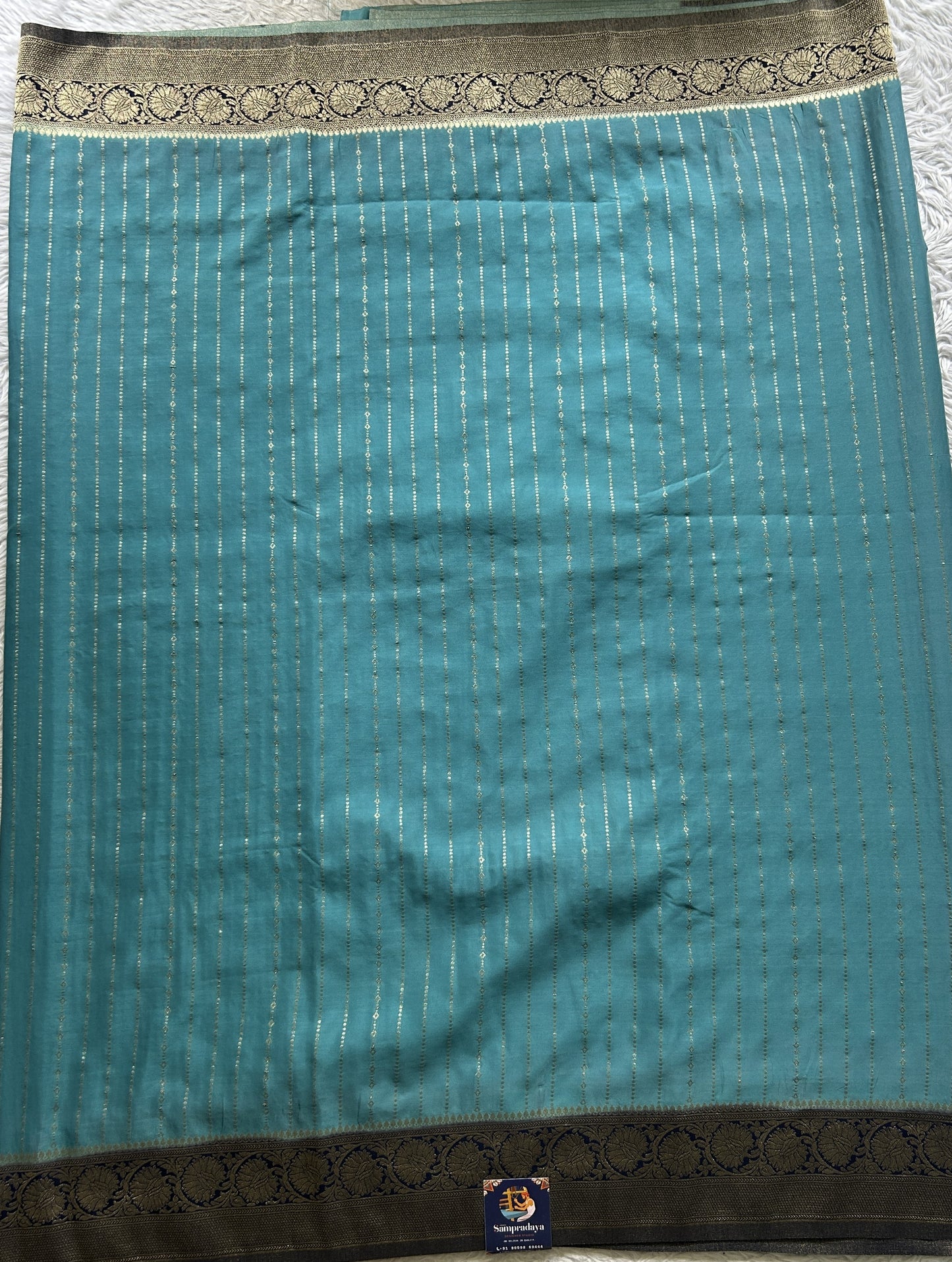 Semi Georgette Saree Aqua Blue Colored Elegantly Paired with a Zari Border. - Sampradaya Designer Studio